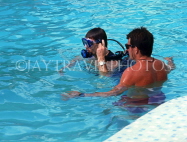 ANTIGUA, instructor giving scuba diving lesson in pool, ANT1325JPL