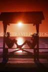 AUSTRALIA, Queensland, GOLD COAST (Surfers Paradise), couple in beach hut, against sunset, AUS1079JPL