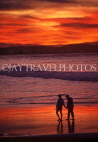 AUSTRALIA, Queensland, GOLD COAST (Surfers Paradise Beach), couple paddling, sunset, AUS1075JPL