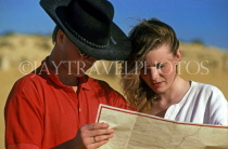 AUSTRALIA, Western Australia, Pinnacles Desert, couple studying road map, AUS1071JPL