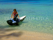 BAHAMAS, Paradise Island, beach, child playing in the sea with float, BAH389JPL