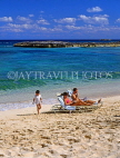 BAHAMAS, Paradise Island, beach, sunbathing couple and child, BAH353JPL
