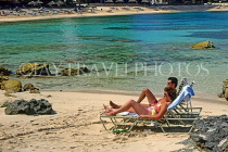 BAHAMAS, Paradise Island, beach and sunbathing couple, BAH366JPL