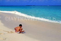 BAHAMAS, Paradise Island, boy playing on beach, BAH262JPL