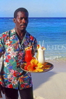 BAHAMAS, Paradise Island, waiter on beach with cocktails on tray, BAH493JPL