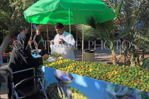 BAHRAIN, Budaiya, Farmers' Market, fruit stall and shopper, BHR1186JPL