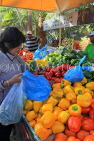 BAHRAIN, Budaiya, Farmers' Market, shopper at vegetable stall, BHR1158JPL