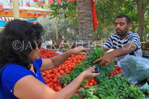 BAHRAIN, Budaiya, Farmers' Market, shopper at vegetable stall, BHR1249JPL