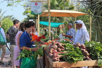 BAHRAIN, Budaiya, Farmers' Market, shoppers at vegetable stall, BHR1250JPL