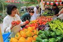 BAHRAIN, Budaiya, Farmers' Market, stalls, peppers, and shopper, BHR2024JPL