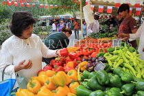 BAHRAIN, Budaiya, Farmers' Market, stalls, peppers, and shopper, BHR2026JPL