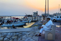 BAHRAIN, Budaiya, seafront, 59th Avenue breakwater, harbour and boats, dusk, BHR2100JPL