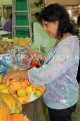 BAHRAIN, Manama, Central Market, shopper buying Mangoes, BHR1291JPL