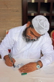 BAHRAIN, Manama, Grand Mosque (Al-Fateh), caligraphy artist on mosque open day, BHR922JPL