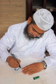 BAHRAIN, Manama, Grand Mosque (Al-Fateh), caligraphy artist on mosque open day, BHR923JPL