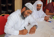 BAHRAIN, Manama, Grand Mosque (Al-Fateh), caligraphy artist on mosque open day, BHR926JPL