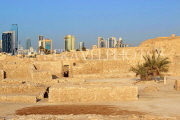 BAHRAIN, Manama, Karababad, Bahrain Fort (Qal'at al Bahrain), Manama skyline, BHR654JPL