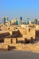 BAHRAIN, Manama, Karababad, Bahrain Fort (Qal'at al Bahrain), Manama skyline, BHR656JPL
