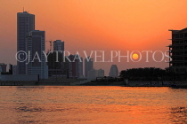 BAHRAIN, Manama, King Faisala Corniche, Sunset over Reef Island, BHR735JPL