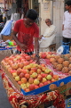 BAHRAIN, Manama Souk (Souq), fruit seller, apples and pomegranates, BHR706JPL