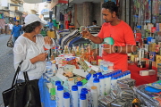 BAHRAIN, Manama Souk (Souq), perfume stall, customer and vendor, BHR993JPL