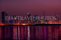 BAHRAIN, Manama night skyline, view from Muharraq coastal fishing village area, BHR2529JPL