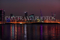 BAHRAIN, Manama night skyline, view from Muharraq coastal fishing village area, BHR2530JPL