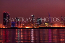 BAHRAIN, Manama night skyline, view from Muharraq coastal fishing village area, BHR2531JPL