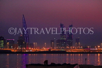BAHRAIN, Manama night skyline, view from Muharraq coastal fishing village area, BHR2532JPL