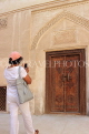 BAHRAIN, Muharraq, Shaikh Isa Bin Ali House, visitor photographing decorative door, BHR816JPL