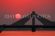 BAHRAIN, Muharraq, Shaikh Isa Causeway Bridge, view from fishing village area, sunset, BHR2505JPL