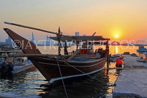 BAHRAIN, Muharraq, coastal fishing village area, Dhow moored by a pier, sunset, BHR2481JPL