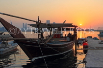 BAHRAIN, Muharraq, coastal fishing village area, Dhow moored by a pier, sunset, BHR2482JPL