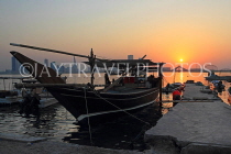 BAHRAIN, Muharraq, coastal fishing village area, Dhow moored by a pier, sunset, BHR2483JPL