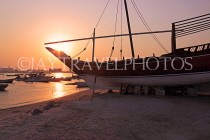 BAHRAIN, Muharraq, coastal fishing village area, Dhow on beach, sunset, BHR2470JPL