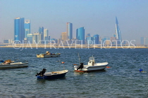 BAHRAIN, Muharraq, coastal fishing village area, fishing boats, and Manama skyline, BHR2493JPL