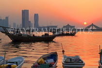 BAHRAIN, Muharraq, coastal fishing village area, fishing boats, and sunset, BHR2496JPL