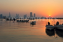 BAHRAIN, Muharraq, coastal fishing village area, fishing boats, and sunset, BHR2498JPL