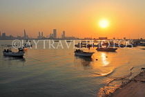 BAHRAIN, Muharraq, coastal fishing village area, fishing boats, and sunset, BHR2502JPL