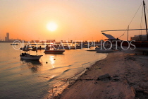BAHRAIN, Muharraq, coastal fishing village area, fishing boats, sunset, and beach, BHR2501JPL