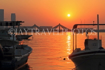 BAHRAIN, Muharraq, coastal fishing village area, view towards Shaikh Isa Causeway Bridge, sunset, BHR2514JPL