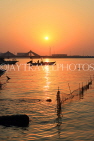 BAHRAIN, Muharraq, coastal fishing village area, view towards Shaikh Isa Causeway Bridge, sunset, BHR2518JPL