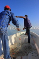 BAHRAIN, coast by Al Jasra, fishermen in boat pulling in net, BHR1402JPL