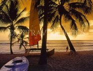 BARBADOS, West Coast, beach, sailboat and coconut trees, dusk, BAR531JPL