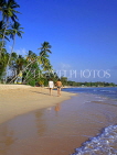 BARBADOS, West Coast, beach and coconut trees, tourist couple walking, BAR1356JPL