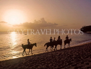 BARBADOS, West Coast, horse riding along the beach, at dusk, BAR542JPL