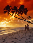 BARBADOS, West Coast, sunset and leaning coconut trees, tourist couple, BAR533JPL