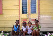 BARBADOS, children posing outside a chattel house, BAR205JPL