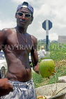 BARBADOS, roadside stall, man with coconut (for drinking), BAR366JPL
