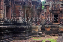 CAMBODIA, Angkor, Banteay Srei Temple, guardian statues & sandstone carvings, CAM1141JPL